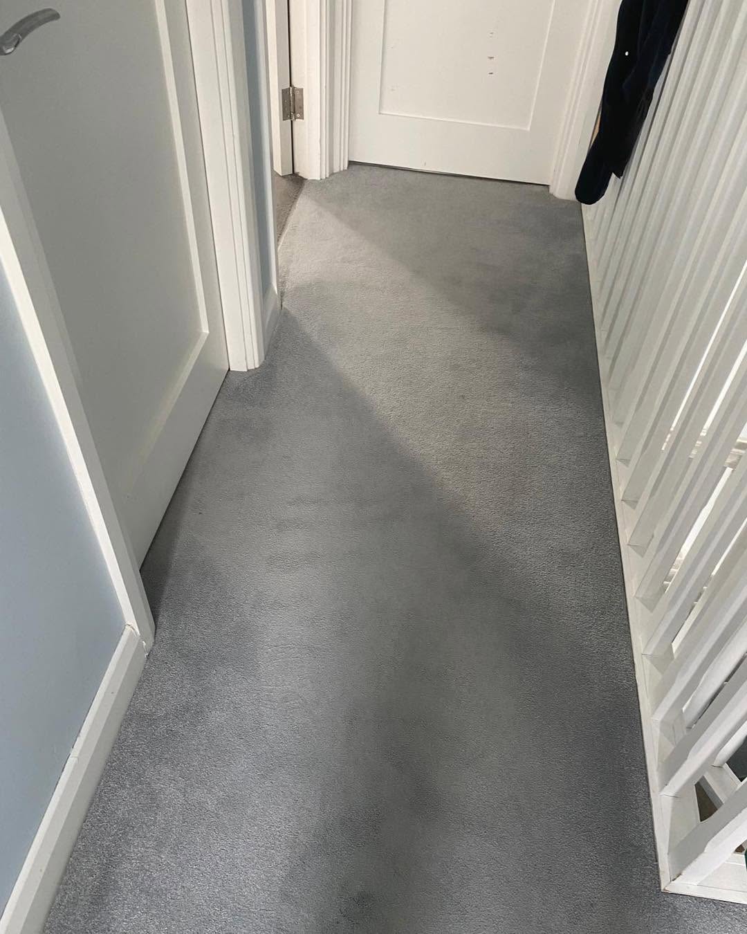 a landing carpet after being cleaned