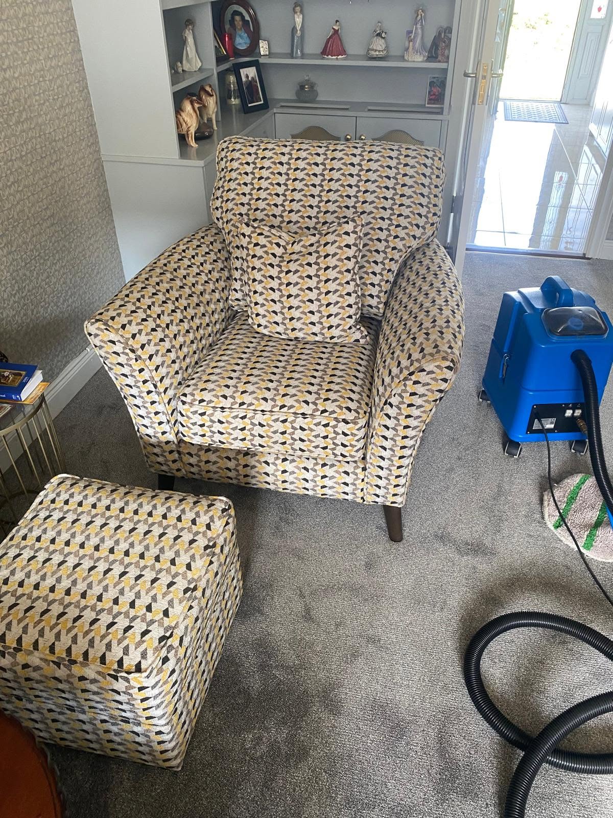 chair being cleaned by an upholstery cleaner