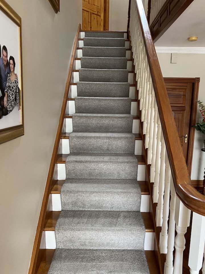 image of a stairs carpet being cleaned.