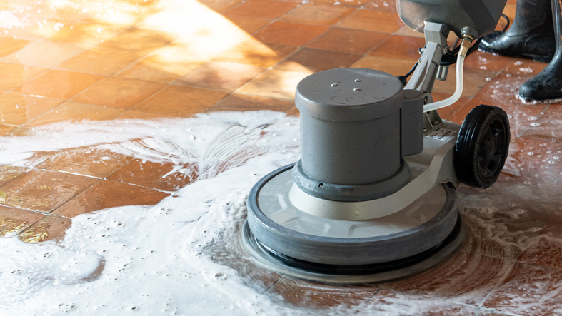 a worker cleaning tiles